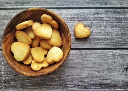 homemade cookies hearts on a wooden background in a plate.  valentines day holiday concept  . top view.