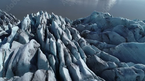 Fjallsárlón outlet glacier, crevasses in glacier, blue patterns. Southeast iceland.
 photo