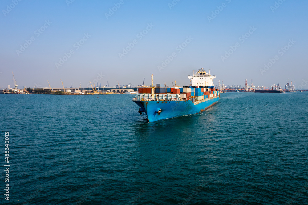  container cargo ship carrying commercial container import export business delivery service commerce cargo logistic and transportation international by container ship in green sea worldwide