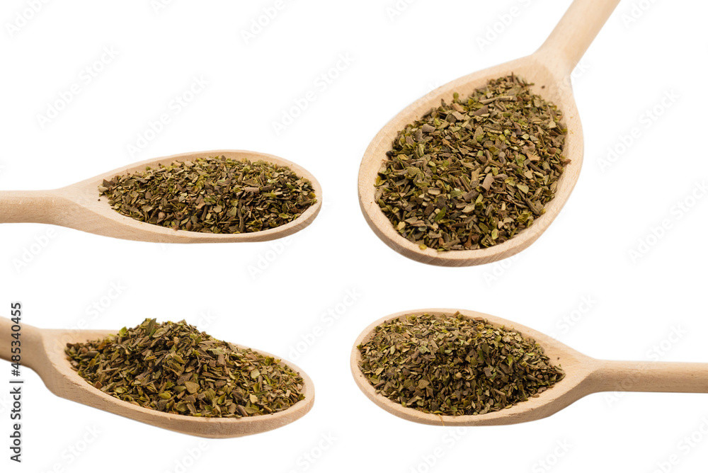 Oregano spice in wooden spoon isolated. Oregano spice in wooden spoon isolated.