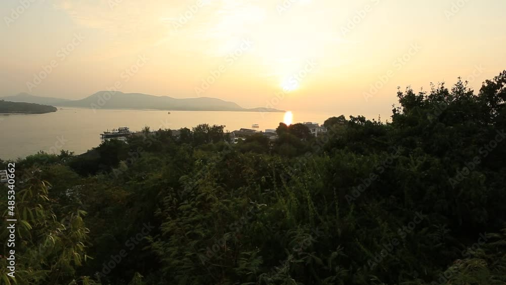 Panoramic nature background (mountains, sea, trees, twilight lights in the sky, waterfront communities), naturally blurred through the wind, seen on tourist spots or scenic spots Panoramic nature background (mountains, sea, trees, twilight lights in the sky, waterfront communities), naturally blurred through the wind, seen on tourist spots or scenic spots