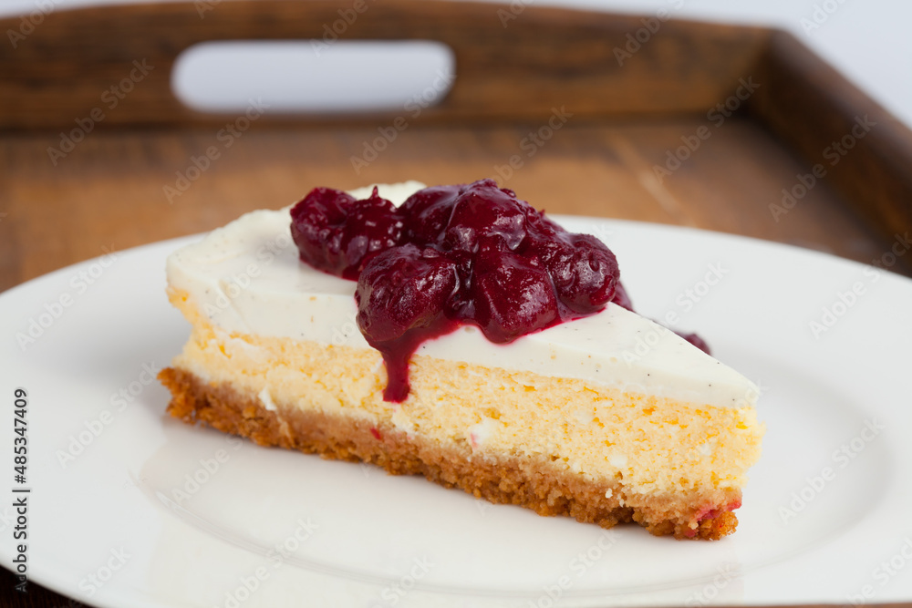 Cheesecake on plate with berries on top Cheesecake on plate with berries on top