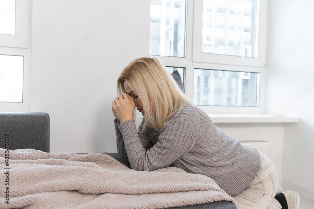 Pray, thinking and closed her eyes at bed room. Person front view, female praying, hope for peace, horizontal banner. Pray, thinking and closed her eyes at bed room. Person front view, female praying, hope for peace, horizontal banner.