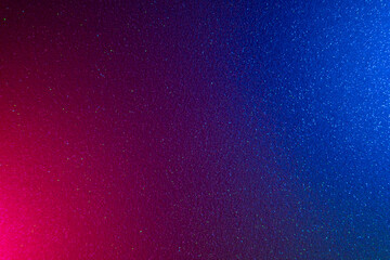 Neon color background. Glitter texture. Holographic radiance. Solar blast. Blur magenta pink blue shimmering grain texture dark color gradient abstract overlay.