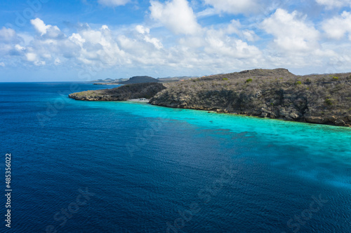 Aerial view of coast scenery with the ocean, cliff, and beach around Porto Mari area, Curacao, Caribbean