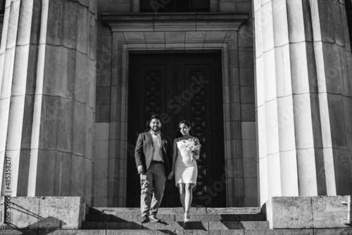 modern latin newlywed couple walking down stairs, black and white photo © juanpablo