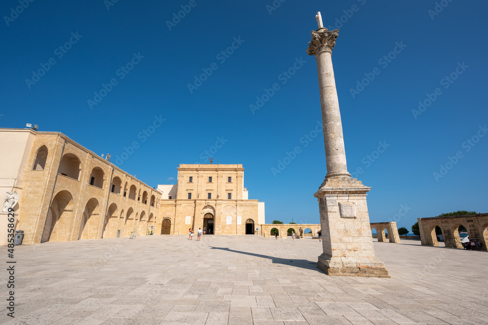 Santa Maria di Leuca, Puglia, Italy. August2021. The sanctuary is located on the lighthouse hill overlooking the bay. In the center of the square an obelisk. Beautiful summer day.