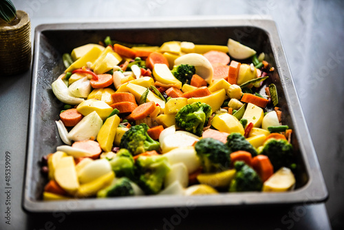 chopped vegetables laid out on an oven sheet