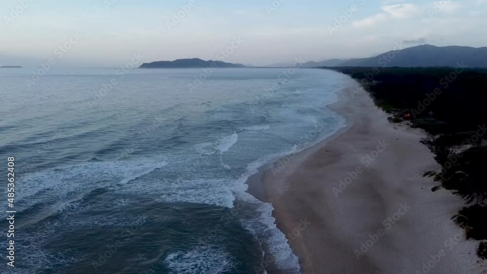 a foggy day on a beautiful paradise beach, top view with drone. beach Mozambique, Florianopolis, Santa Catarina, Brazil a foggy day on a beautiful paradise beach, top view with drone. beach Mozambique, Florianopolis, Santa Catarina, Brazil