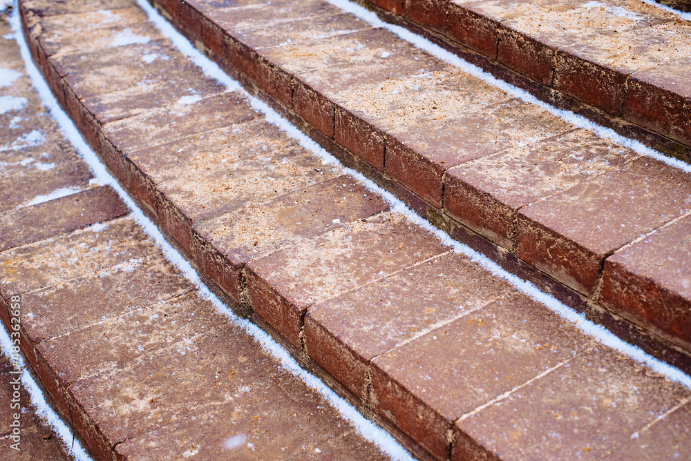 Sand sprinkled on outdoor stairs to prevent slipping on slick steps