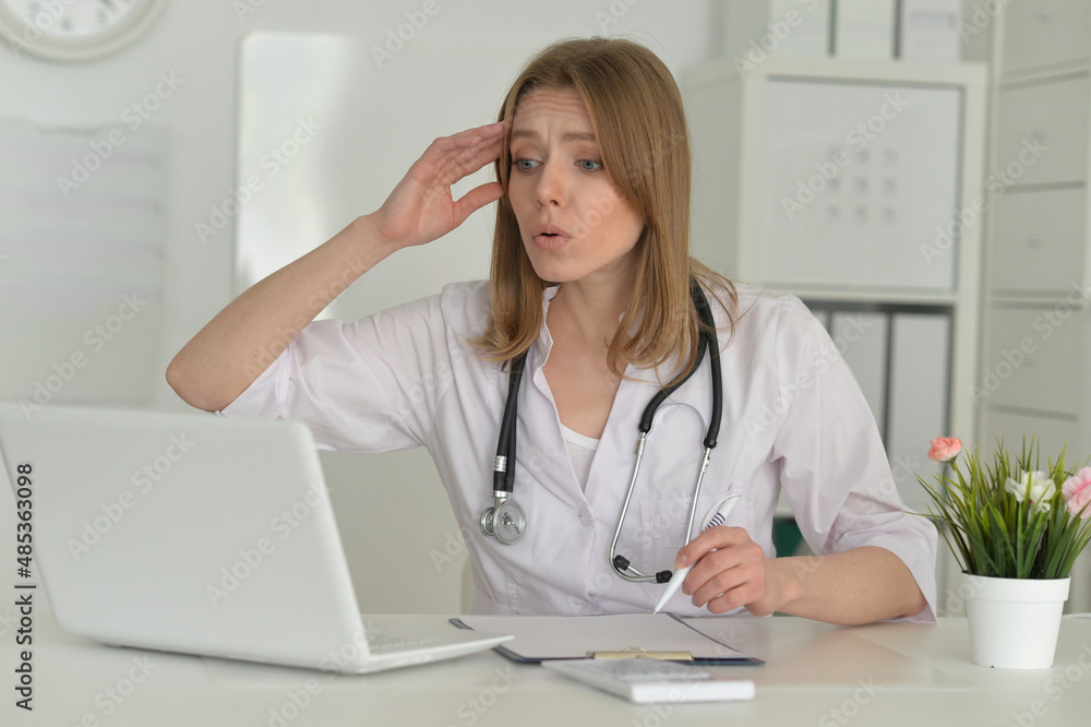 Portrait of smiling female doctor in hospital