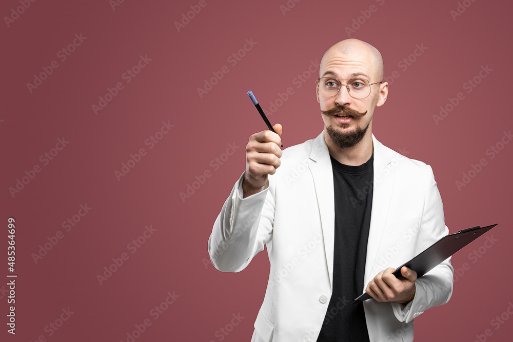 Male lecturer university or college points by pen, holds clipboard when explaining new theory
