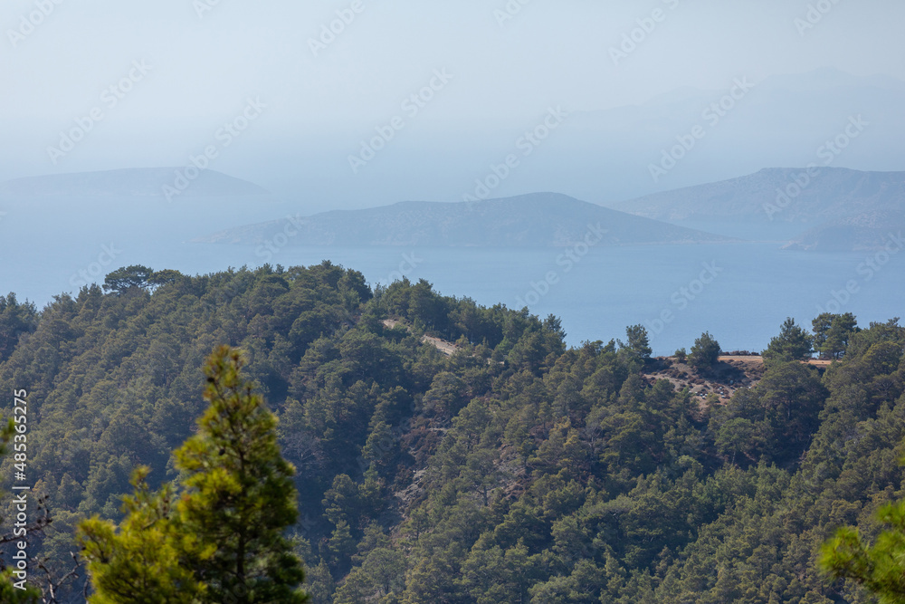 Seascape with multi-tiered backgrounds receding into the distance. Silhouettes of mountains in the sea Seascape with multi-tiered backgrounds receding into the distance. Silhouettes of mountains in the sea