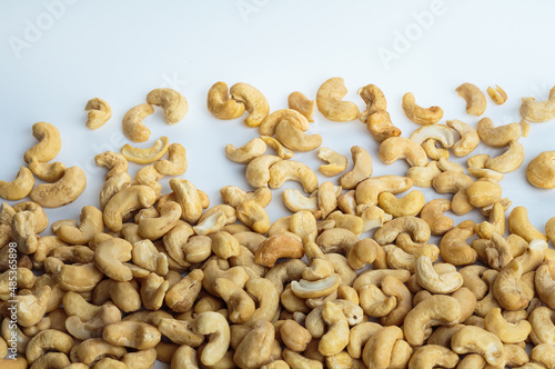 Dried cashew nuts on white background.