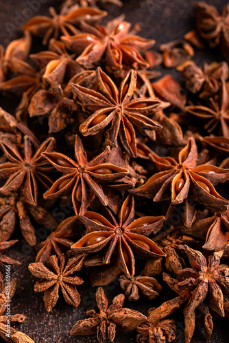Anise stars herbs on rustic old table.