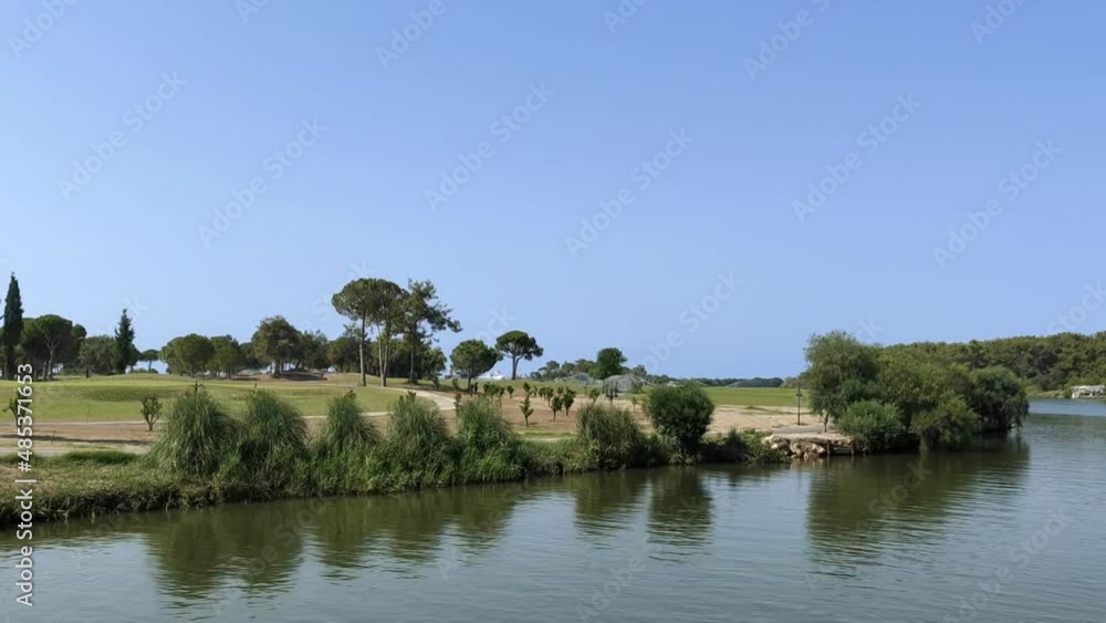 Automatic watering of grass lawns and golf courses on the river bank Automatic watering of grass lawns and golf courses on the river bank