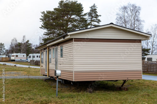 Caravan mobile home at a campsite. Grey winter day. No visible people © Andreas Bergerstedt
