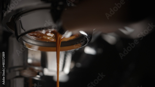 closeup espresso extraction from naked portafilter