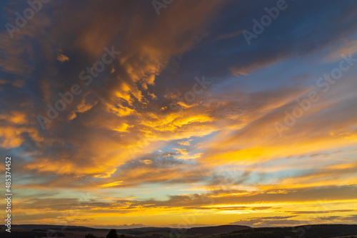 sunset in late summer with colorful clouds