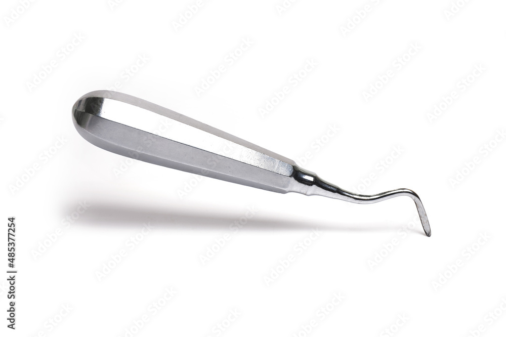 Fototapeta premium angled dental tool levering teeth white background