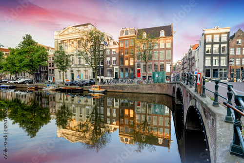 Amsterdam Canal houses at sunset reflections, Netherlands