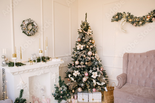 Beautiful living room interior with fireplace and Christmas tree  Christmas decor