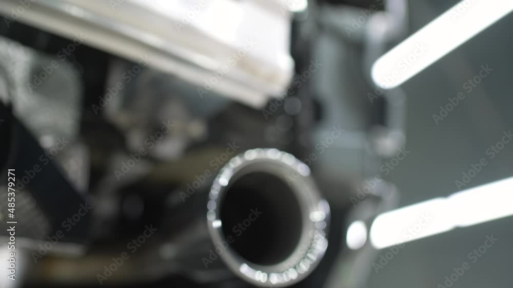 Closeup of clean car muffler. New generation of sportive mufflers. Double Car Exhaust Pipe chromed made of stainless steel. Powerful exhaust pipe from the car. Closeup of clean car muffler. New generation of sportive mufflers. Double Car Exhaust Pipe chromed made of stainless steel. Powerful exhaust pipe from the car.