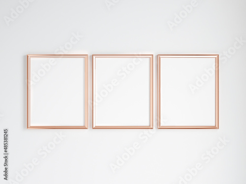 three vertical gold frames on the wall, minimalist mockup, 3d render