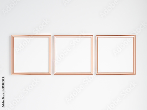 three square gold frames on the wall, minimalist mockup, 3d render