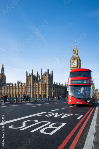 Historic and Iconic Westminster palace and 2022 revealed Big Ben after restoration works with London red bus driving by