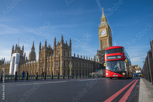 Historic and Iconic Westminster palace and 2022 revealed Big Ben after restoration works with London red bus driving by