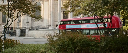 Red Bus Double Decker Carter Lane Gardens St. Paul's Cathedral Slow Motion London 1 photo