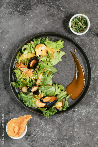 Healthy salad plate. Fresh seafood recipe. fresh vegetable salad. Grilled prawns. Healthy food. Flat lay.