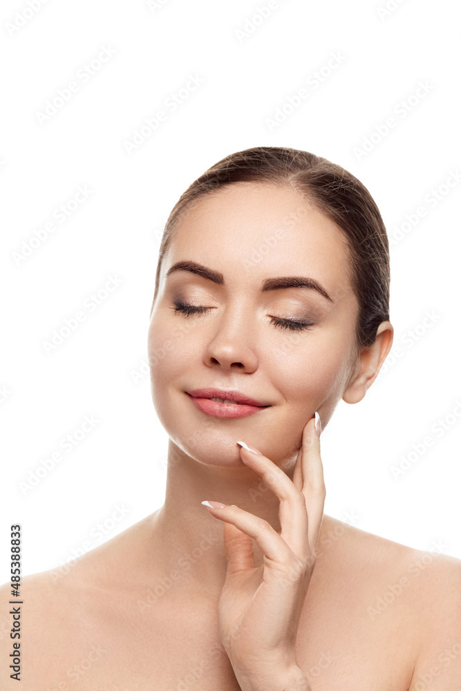 Beautiful Young Woman with Clean Fresh Skin touch own face . Facial treatment. Beauty and spa . Skin Care. Cosmetics. Beautiful Young Woman with Clean Fresh Skin touch own face . Facial treatment. Beauty and spa . Skin Care. Cosmetics.