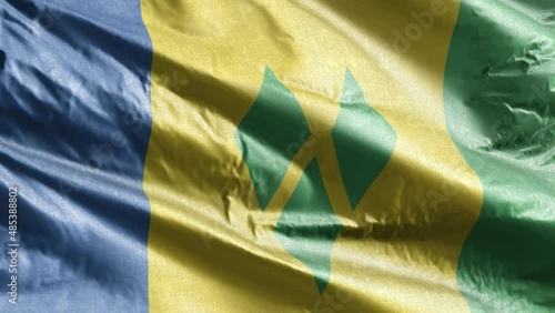 Saint Vincent and the Grenadines textile flag slow waving on the wind loop.  Fabric textile tissue. Full filling background. 20 seconds loop. photo