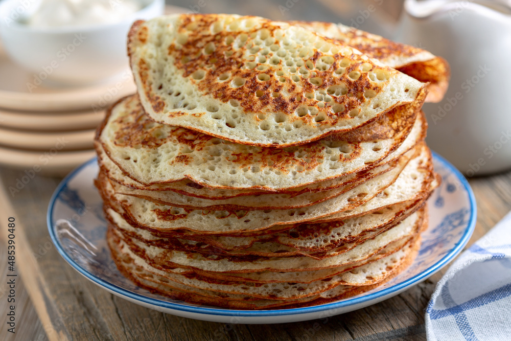 Yeast pancakes on a plate. Yeast pancakes on a plate.