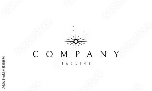 Vector logo on which an abstract image of a shining star with rays.