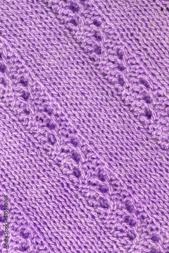 Diagonal handmade knitted pattern in soft lilac color.