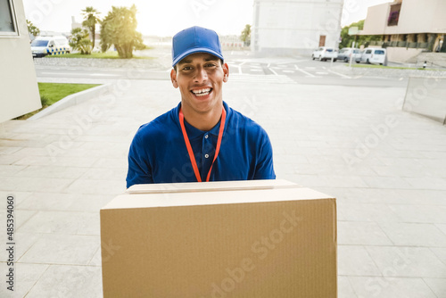 POV of african courier man ringing doorbell for shipping package - Focus on face