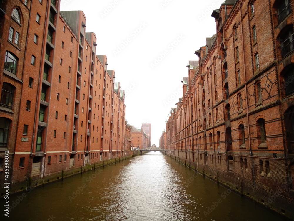 View of canal and historic  building in old ware house district, Speicherstadt in Hamburg, Germany