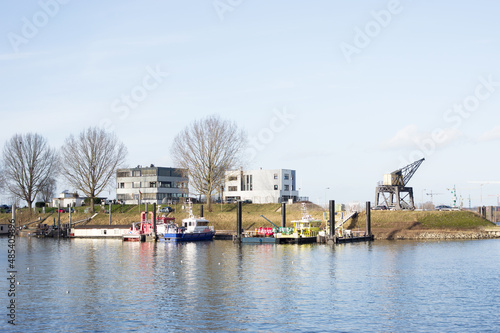 Small harbor with a police boat and a fire boat in Nijmegen in the Netherlands