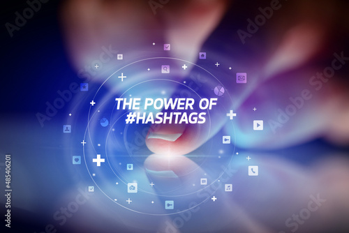 Finger touching tablet with social media icons concept