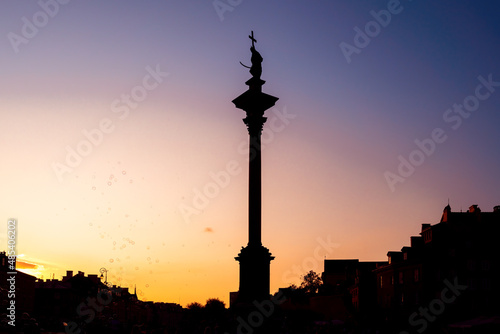 Sigismunds Column silhouette at sunset erected in 1643 and designed by Constantino Tencalla and Clemente Molli at Castle Square - Warsaw  Poland
