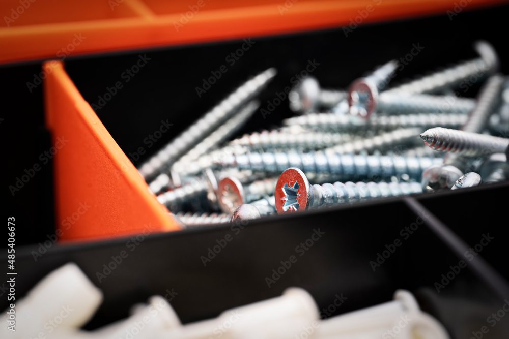 Close up of pile of metal screws in a toolbox Close up of pile of metal screws in a toolbox