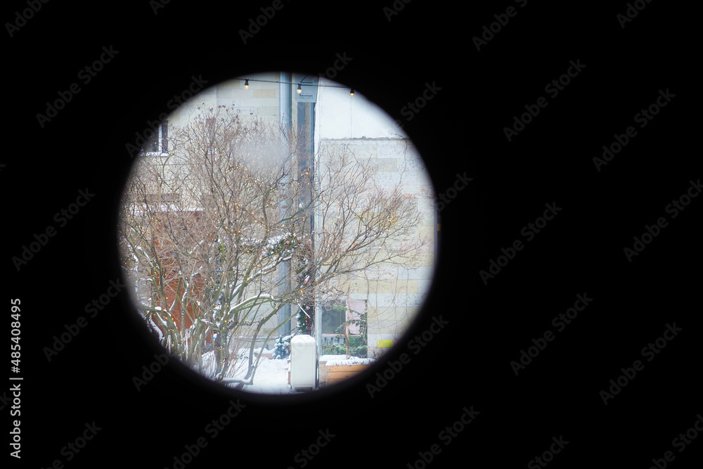 City view from binoculars. Modern festive city in the crosshairs of terrorism, concept City view from binoculars. Modern festive city in the crosshairs of terrorism, concept