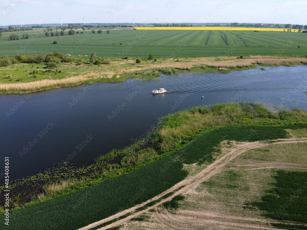 Obraz premium Small yacht sailing on river, Zulawy Wislane, Poland