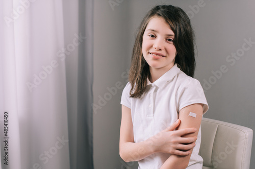 Free Download Vaccination of children. Vaccinated teenage girl smiling looking at camera. - GFXLoad