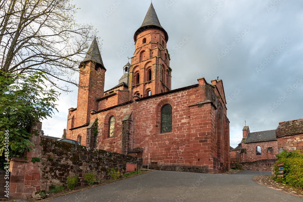 A red stone Roman church in Correze, France