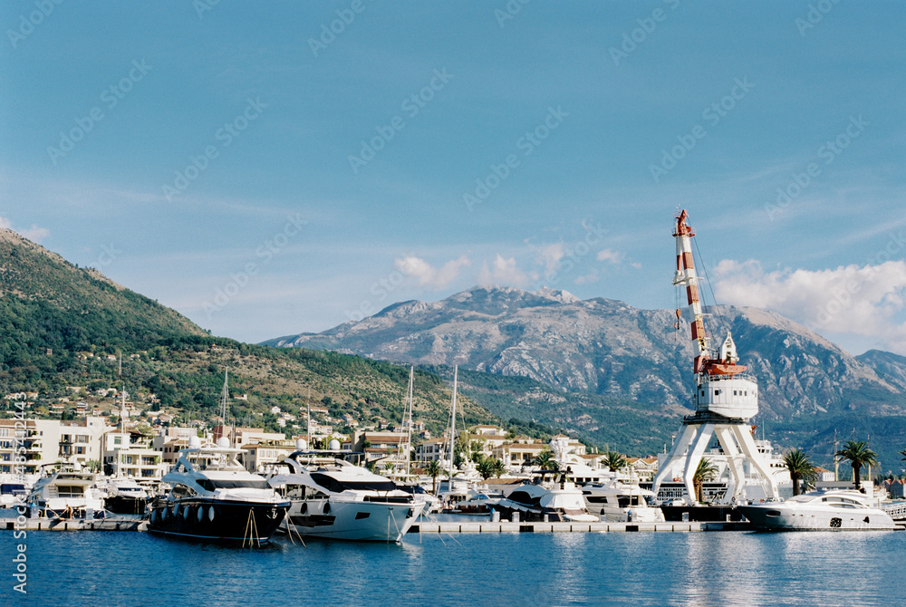 Crane on a platform near the marina in Porto. Montenegro