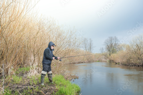 Fishing on the river bank. © alexey351